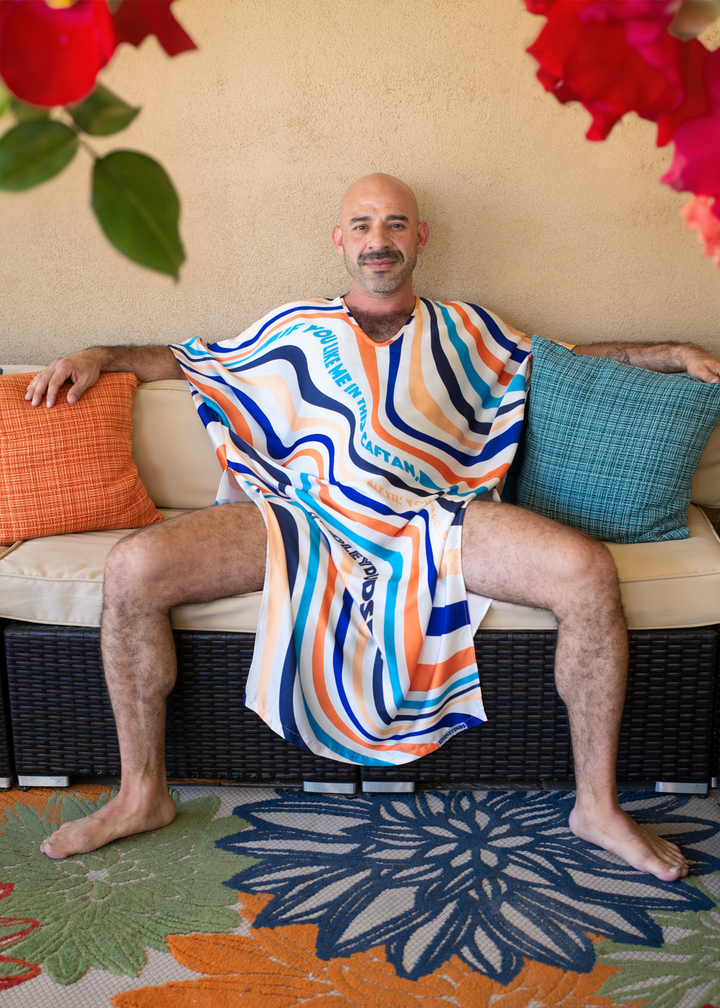 Man sits in wavy caftan