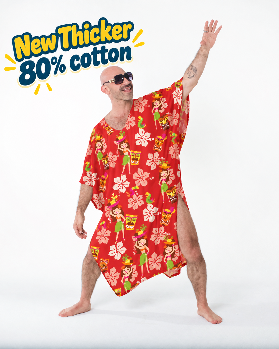 Man in sunglasses wearing the red Cheeky Tiki caftan with island girls, tiki masks and hibiscus, arm raised
