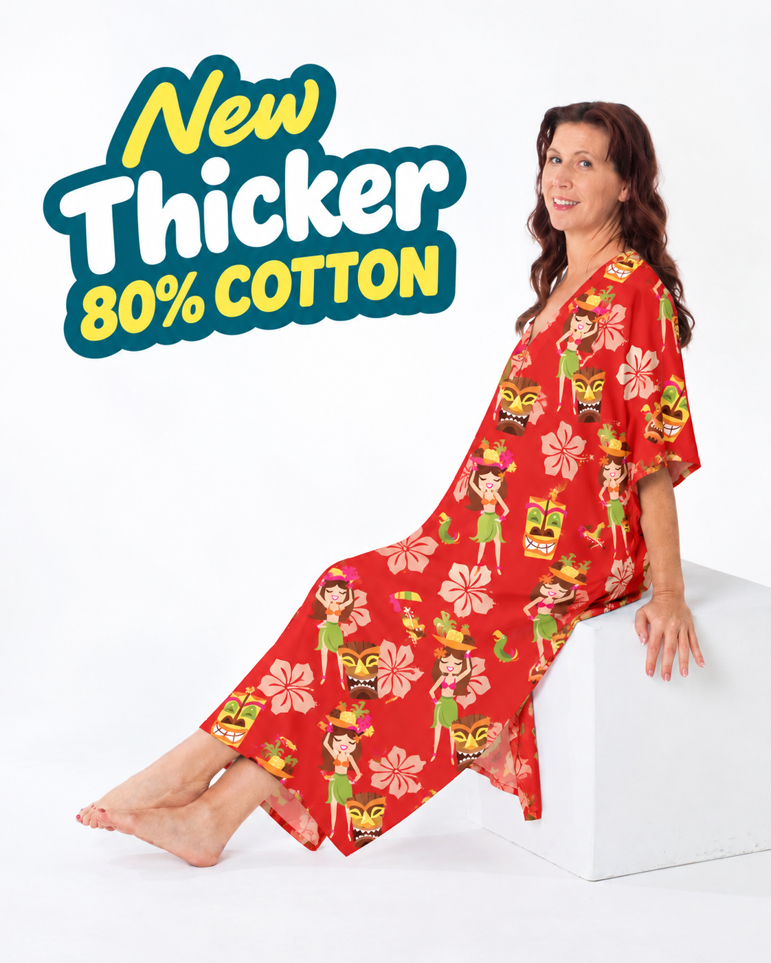 Woman lounging in the full-length red Cheeky Tiki caftan with island girl and tiki mask print