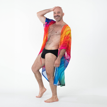A man wears a rainbow kimono